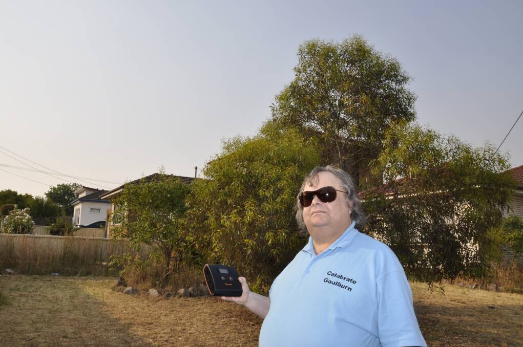 Goulburn man Lindsay Allen recorded pollution particles with his new air quality monitor at his home on Monday morning. Photo: Louise Thrower.