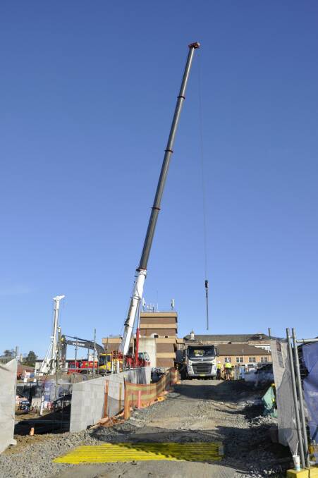 A 130-tonne mobile crane was brought in to help install the tower crane. Photo: Louise Thrower.