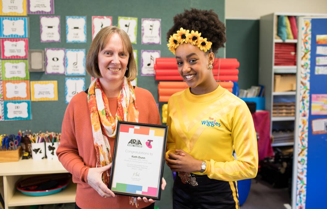 Wollondilly Public School music teacher and Yellow Wiggle Tseyah Hawkins with the Telstra ARIA award nomination. Picture supplied. 