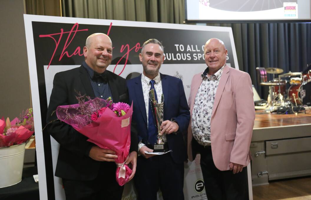 People's Choice award winners Craig Norris and Brandon Doggett of Evolution Trophies with Goulburn Chamber of Commerce president Darrell Weekes at the 2022 Business 2580 awards night. Photo: Sophie Bennett.