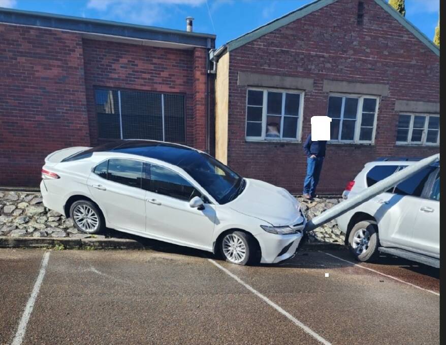 A vehicle went over an embankment on Deniehy Lane, off Sloane Street, and hit a power pole, which in turn struck two parked vehicles on Saturday afternoon. No one was injured. Picture by NSW Fire and Rescue.