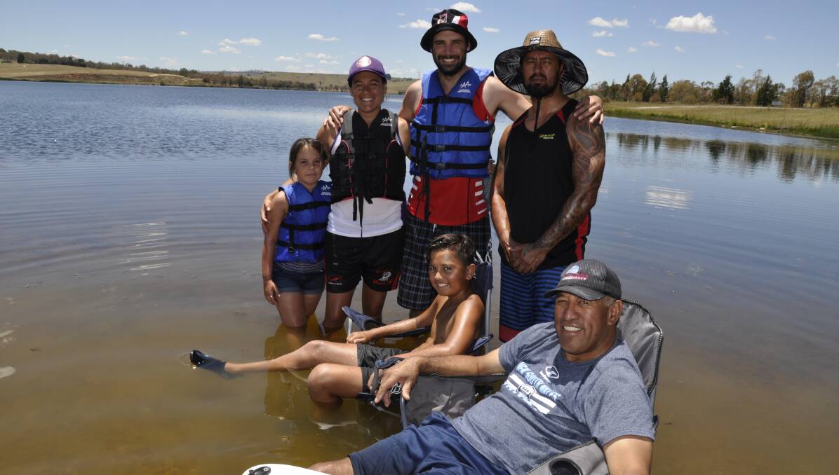 SUMMER: Kevin Kara (front), Harmony Waaka, Ashley Kara, Cameron Waaka, Andrew Mewburn and Shane Waaka relaxing at Pejar Dam.