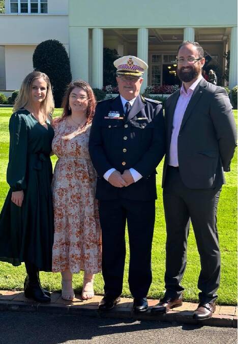 Brian White's children Natalie, Laura and Brendon celebrated their father's Ambulance Service Medal, awarded at Government House. Picture supplied. 
