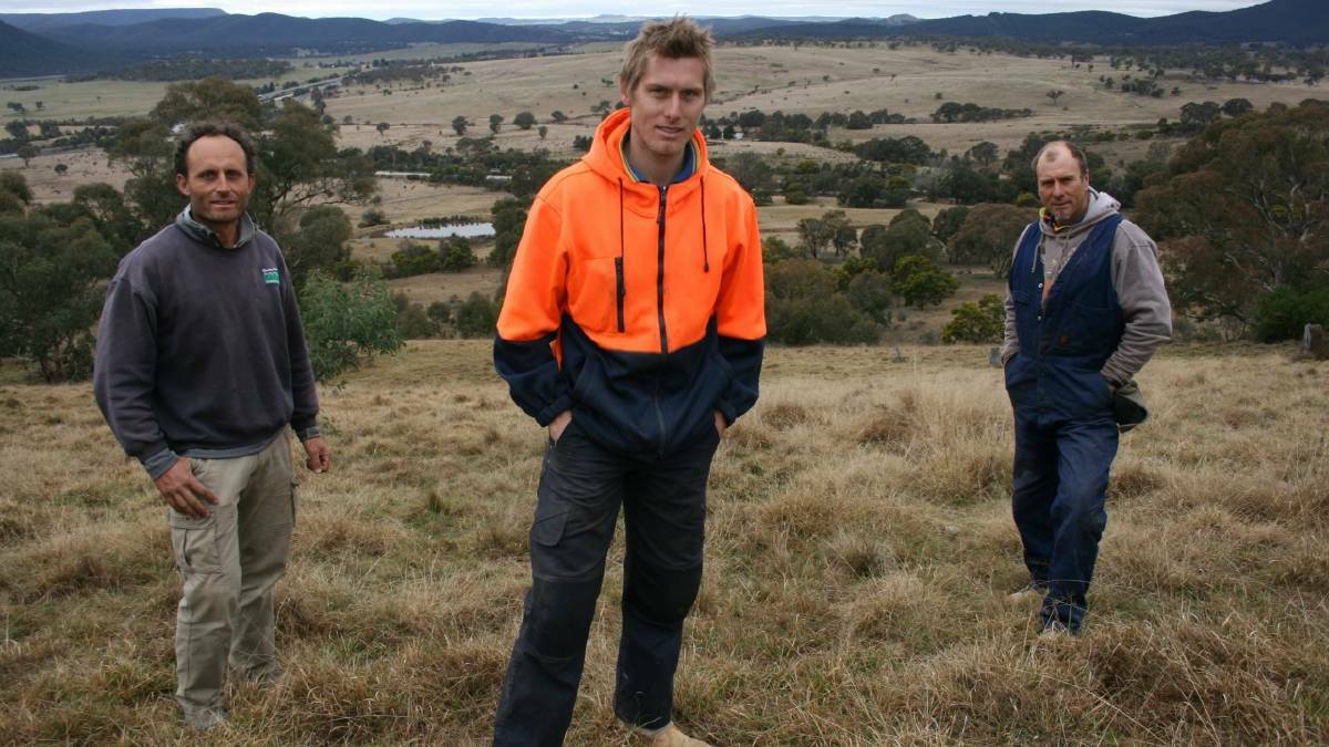 Motorcycling champion Troy Herfoss (centre), Goulburn Motorcycle Club president Richard Toparis (left) and Troy's father, mark, also a Club member, pictured above the planned track in 2013. Mr Toparis says members have been waiting too long to start work.