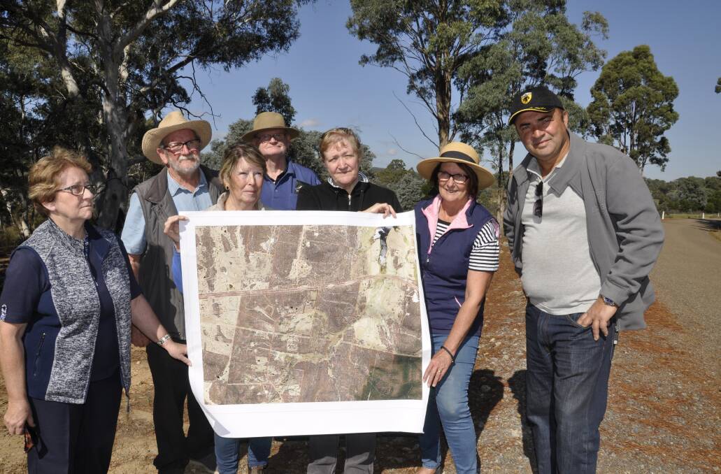 Graeme Dally (second left) and the Neighbours of Winfarthing Road are opposed to Global Quarries Australia's plans for the area. They are pictured here in 2019. Photo: Louise Thrower.