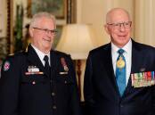 Governor General David Hurley AC, DSC, FTSE (right) presented Goulburn's Brian White with an Ambulance Service Medal at Government House on Friday. Picture by Government House.