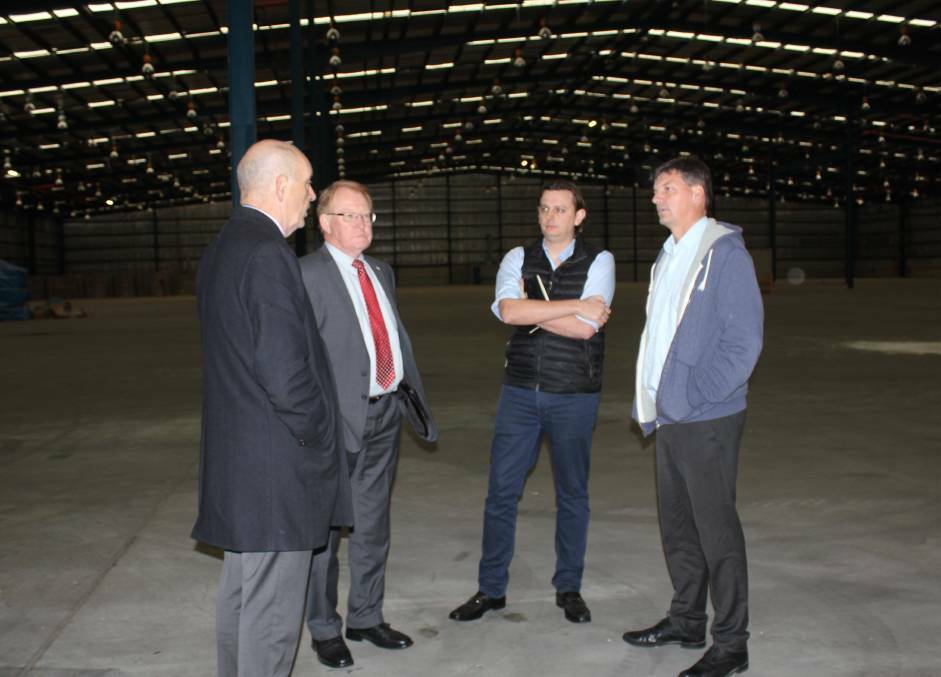 Hume MP Angus Taylor (right) with Tribe Breweries CEO Anton Szpitalak (second right), council general manager Warwick Bennett and Mayor Bob Kirk at the company's South Goulburn site last year.