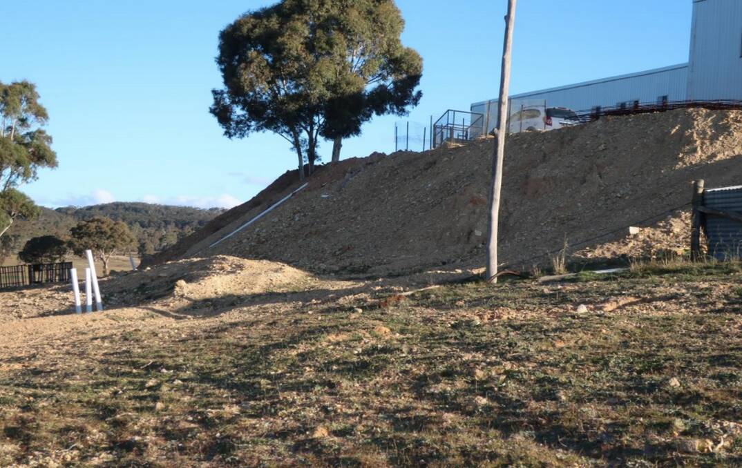 Council general manager Warwick Bennett said "half a hill" was excavated to make way for the 46-metre wide by 21m long structure. In January, the state government issued a $5000 fine to the owner for clearing 10ha of vegetation. Photo: Supplied.