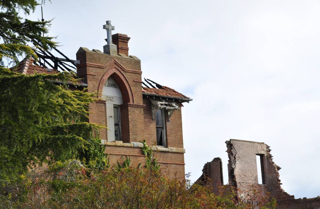 A crucifix on the old orphanage's facade is among the items to be retained. Photo: Louise Thrower.