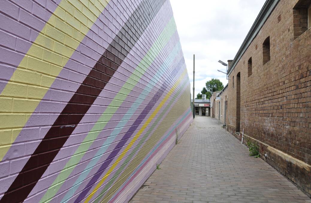 Walker Lane has been improved in recent years with tiling and a mural. Picture by Louise Thrower.