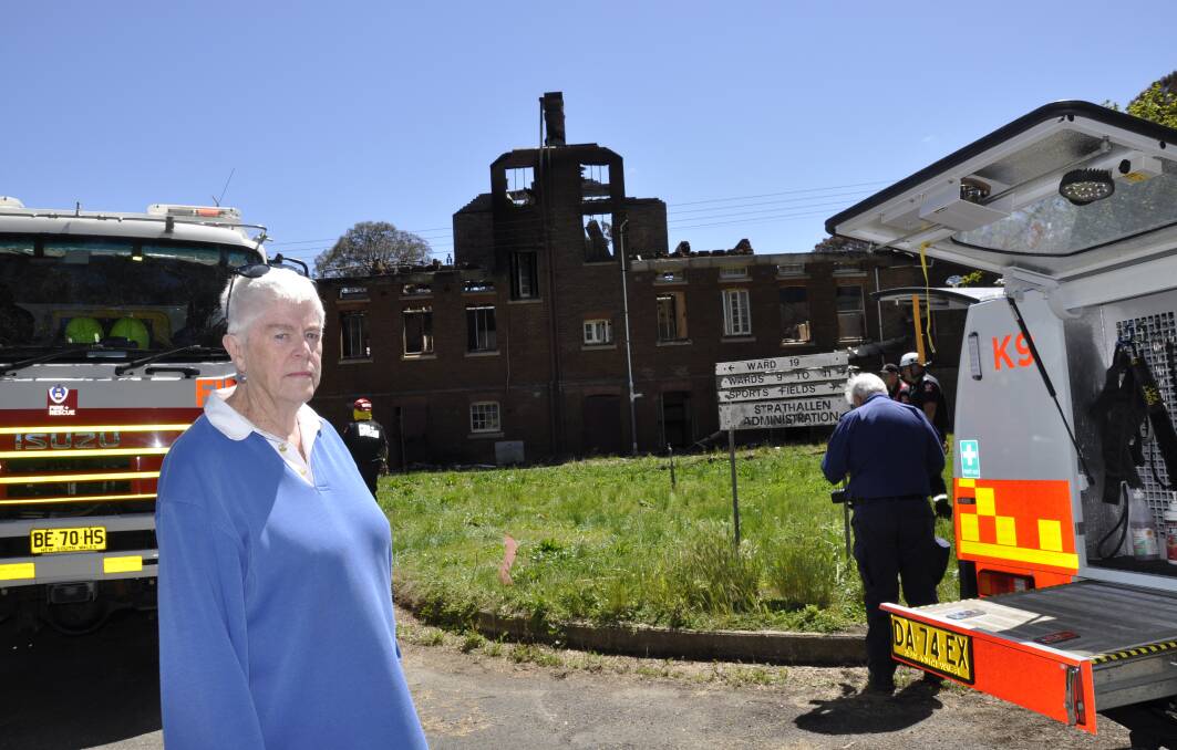 Leone Morgan visited the fire-damaged building the day after the fire. She would like to see meaningful action at the site. Photo: Louise Thrower.