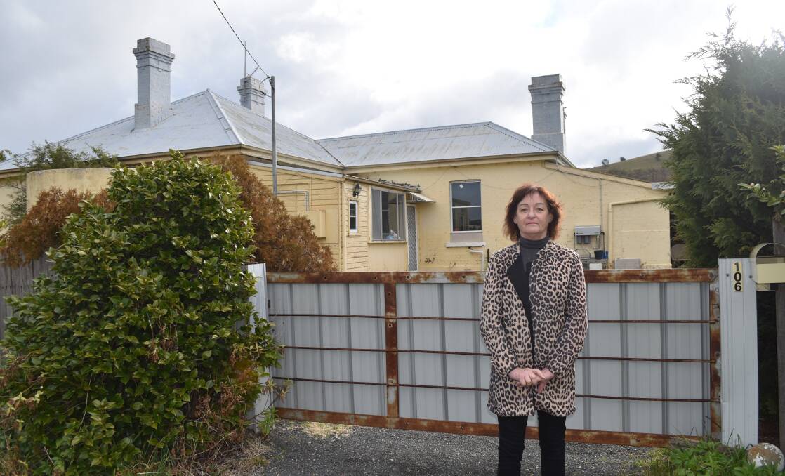 LOBBYING: Tarago businesswoman and Progress Association member Judy Alcock wants the former railway station master's cottage made available for a beneficial community use. Transport for NSW has acquired the house which had lead contamination. Photo: Megan Alcock.