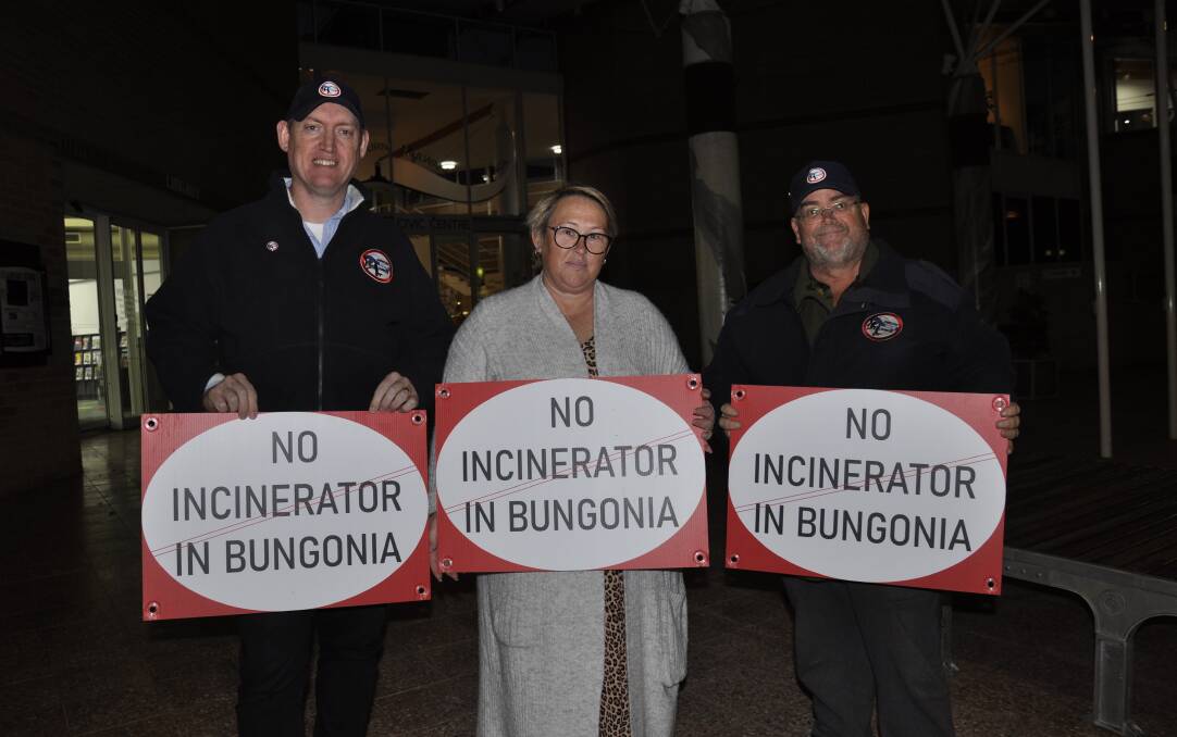 SENDING MESSAGE: Shooters, Fishers and Farmers president Andy Wood (left) and secretary Darren Plumb (right) joined Jerrara Action Group member Leisha Cox-Barlow in a mini-protest outside the council chambers on Tuesday night. Inside, Jerrara Power briefed councillors about its waste to energy proposal for Bungonia. Photo: Louise Thrower. 
