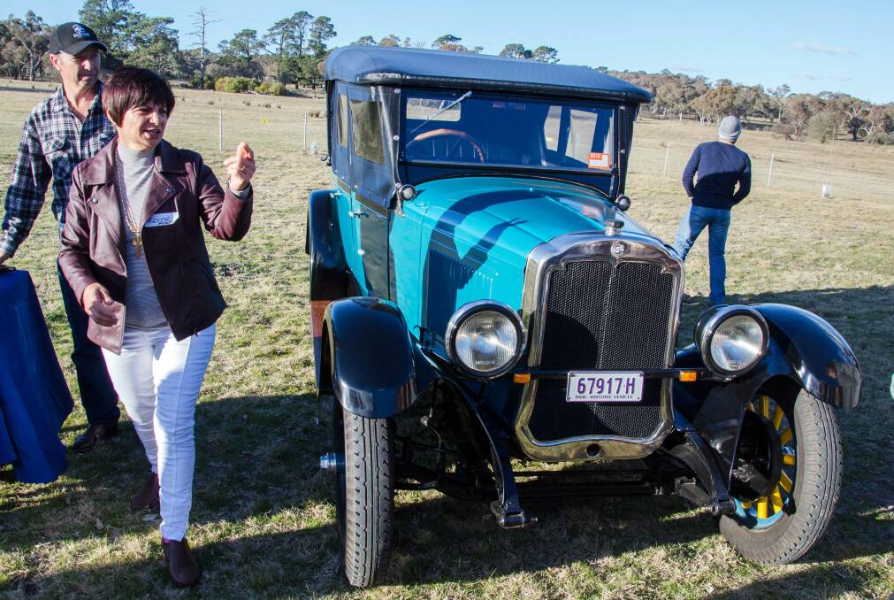 VINTAGE: Shayne Friend (rear) and wife Kerrie gathered with the Apps family at the recent family reunion at Yarra where the 1927 Oldsmobile took pride of place.