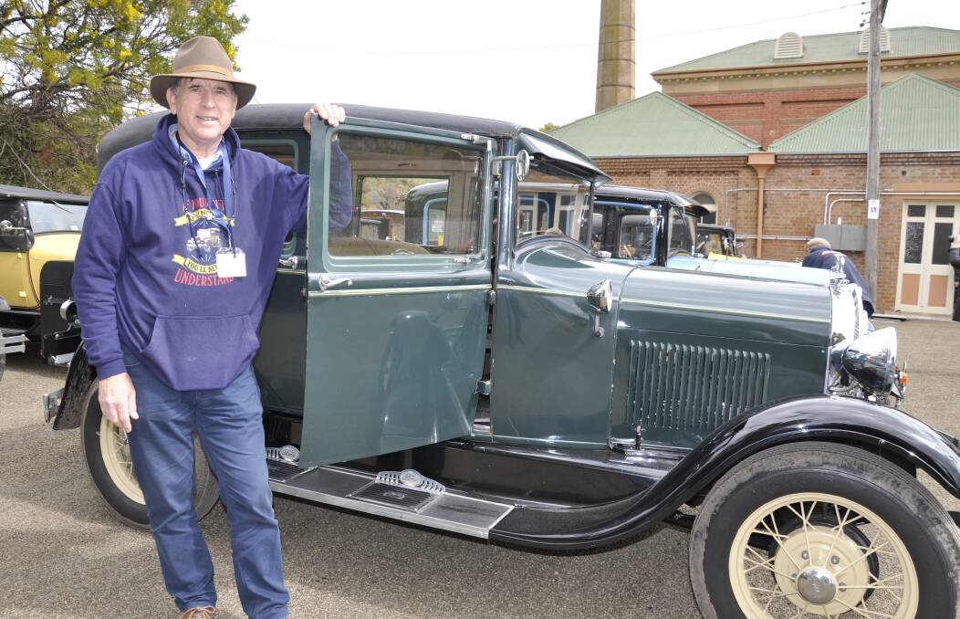 Model A Ford National Meet secretary Rob Taylor with his 1928 four-door Blindback, which he purchased in its restored state five years ago. Picture by Louise Thrower. 
