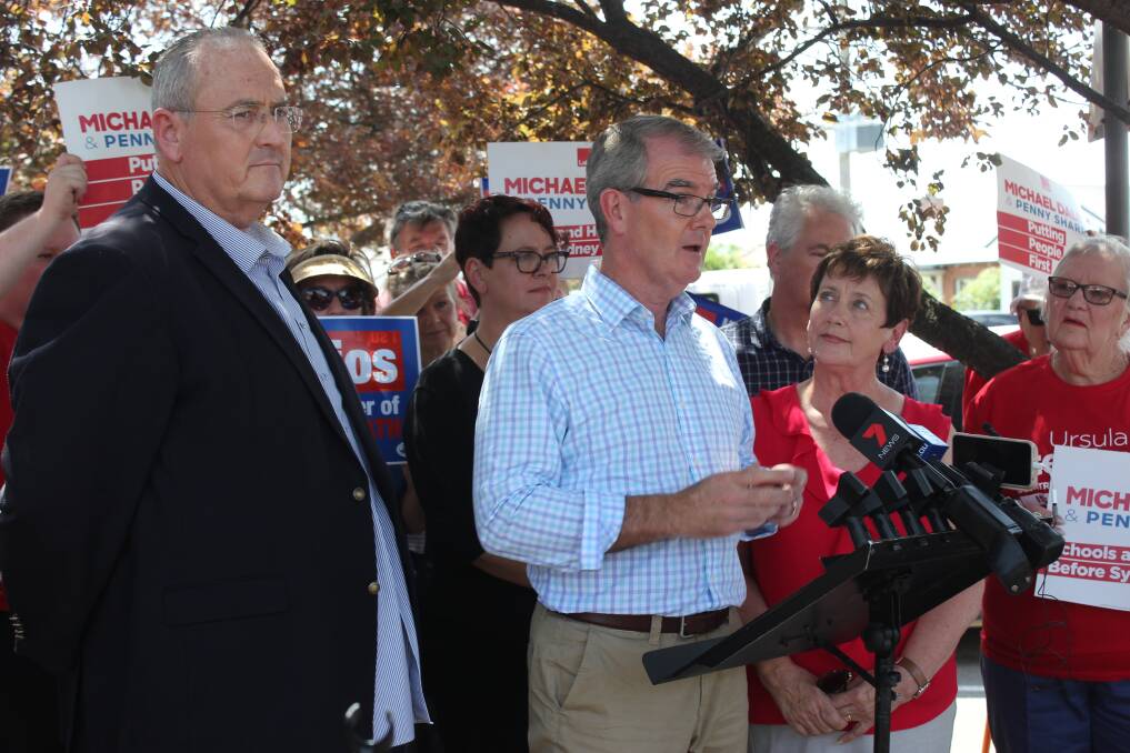 Labor leader Michael Daley (centre) announced an extra $50 million for Goulburn Base Hospital on Monday, taking the commitment to $200m. He was flanked by Opposition Health spokesman Walt Secord and Labor candidate for Goulburn, Dr Ursula Stephens. Photo: David Cole.