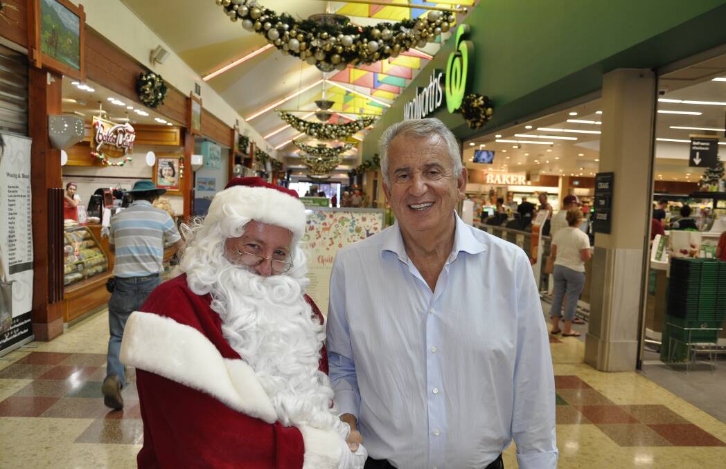 Former marketplace owner Paul Lederer caught up with Santa Claus during a December, 2018 visit to Goulburn. Photo: Louise Thrower.