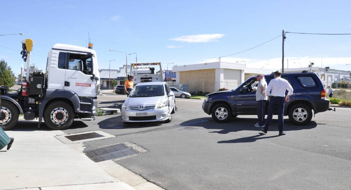 Goulburn Mazda owner Kieran Davies assisted people involved in a three-car crash in Bradley Street on Thursday morning. Photo: Louise Thrower.