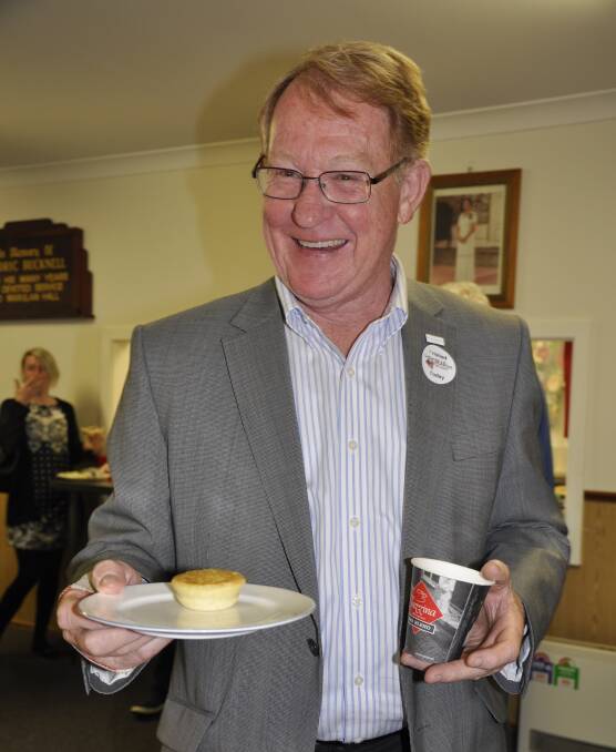 SUPPER: Mayor Bob Kirk indulged in just some of the tasty delights turned out by the Marulan Lions Club after the outreach meeting on Tuesday.