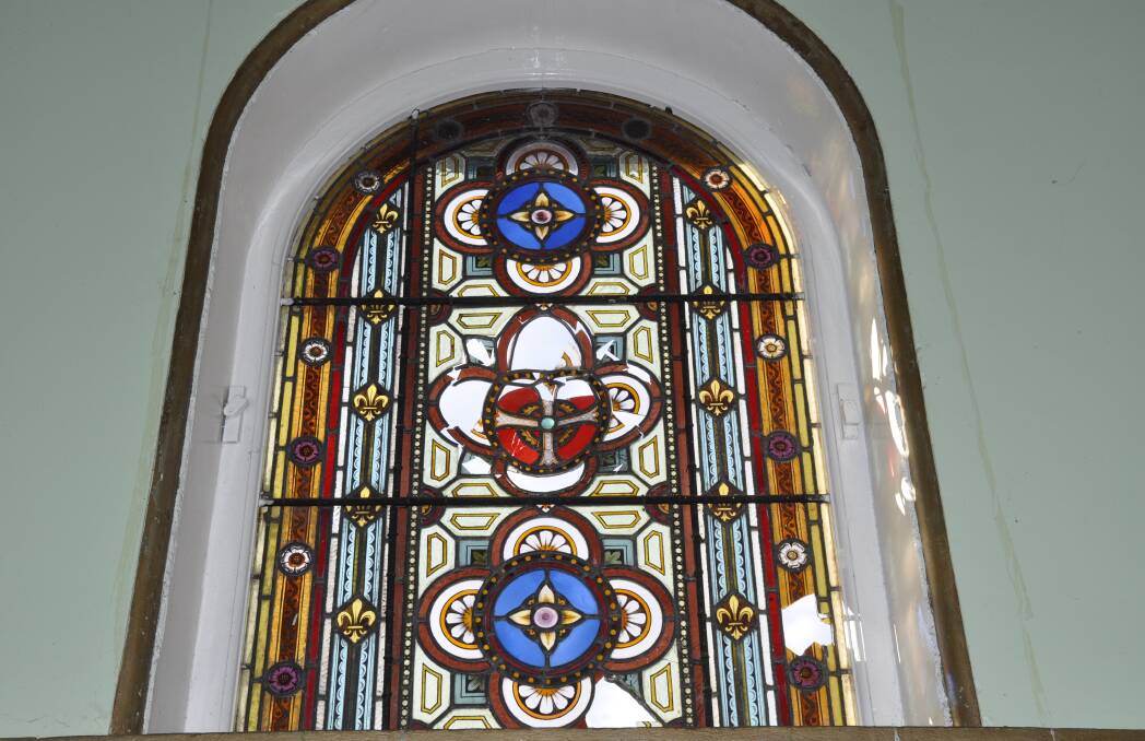 Precious stained glass windows in the former chapel on the Kenmore site have been broken. Photo supplied. 