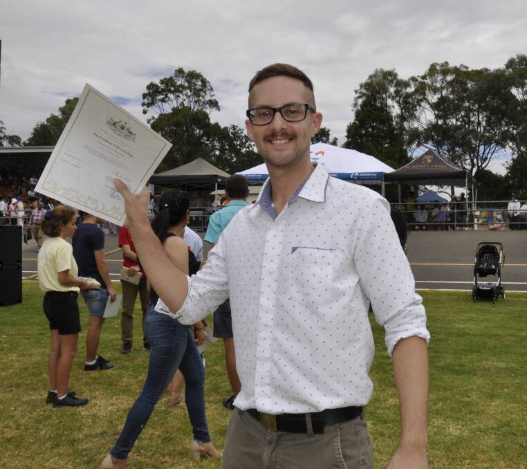 David Weaver, from England, proudly displayed his citizenship certificate. Photo: Louise Thrower.