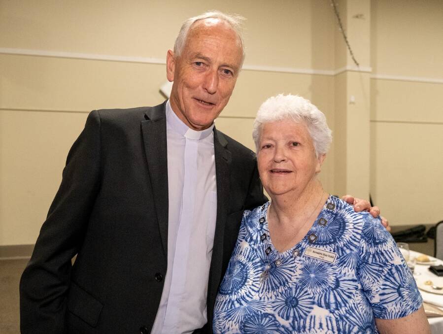 Monsignor John Woods and Sister Bernadette Mary Walsh caught up at the function. Picture by Tom Saunders. 