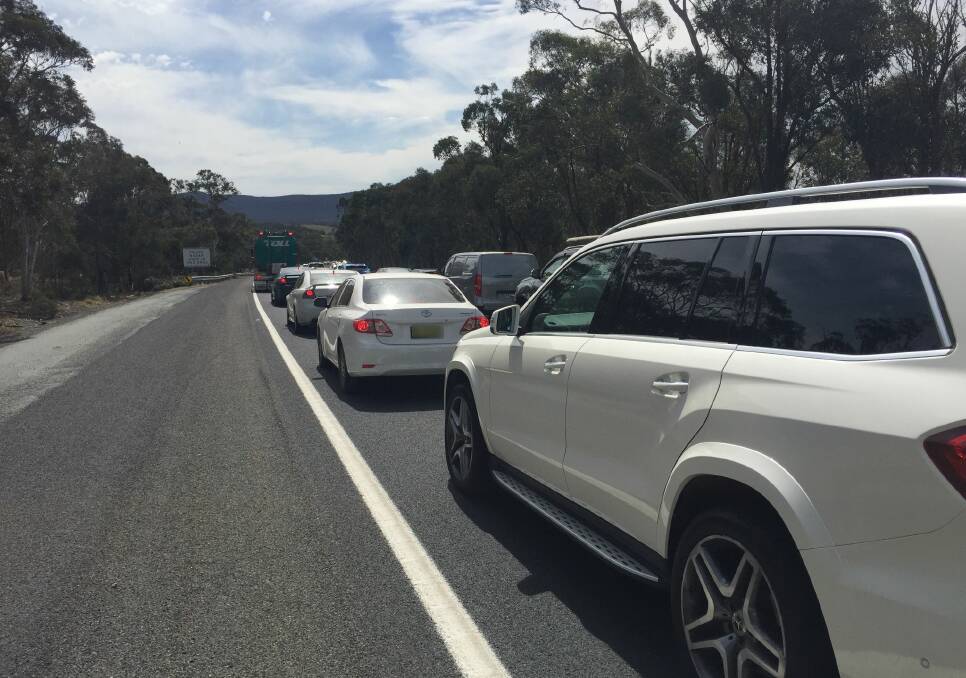 Traffic banked up the Hume Highway last year following a two-car crash. Many of the vehicles diverted along Carrick Road nearby. The road will receive an 8km seal under the Fixing Country Roads program. Photo: Louise Thrower.
