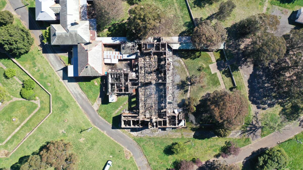 SALVAGABLE?: Council general manager Warwick Bennett said though fire extensively destroyed timber in the former female ward, some of the building retained structural integrity. Photo: NSW Fire and Rescue.
