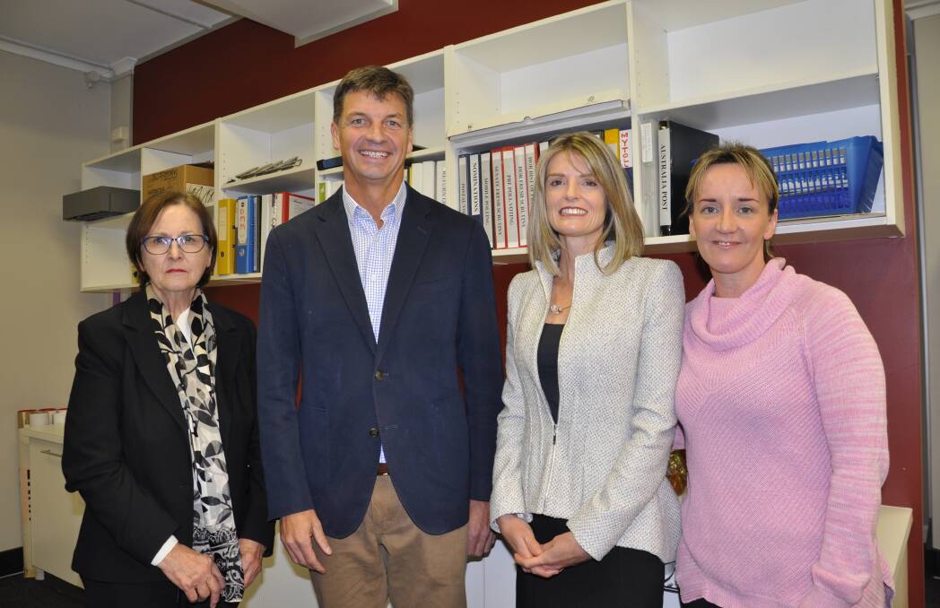 WINNER: Hume MP Angus Taylor caught up with Hume electoral office returning officer Melissa Merryful (second right) and staffers Susan Mamo and Lisa Thomas at Friday's declaration of the poll.