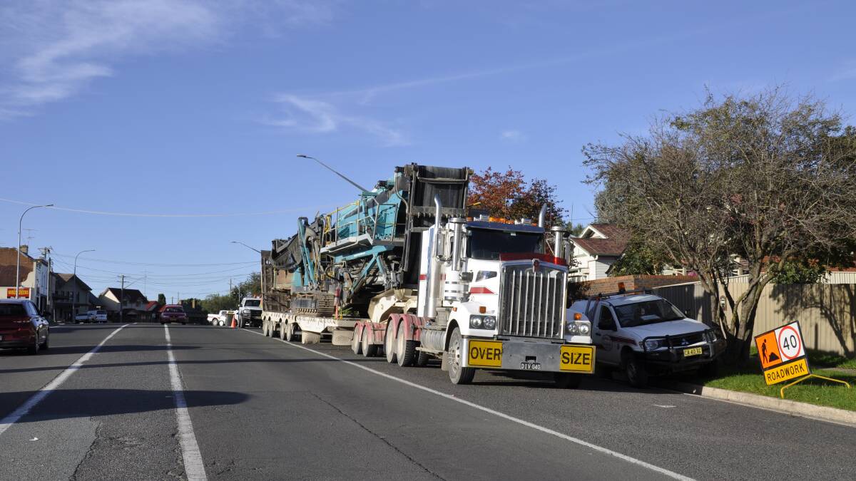 Truck carrying heavy plant hits powerlines in city's CBD
