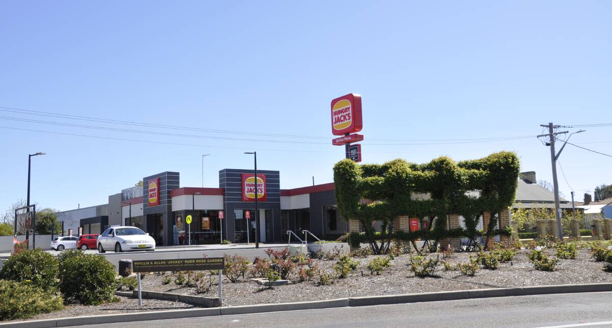 Signage at the Hungry Jack's outlet in northern Auburn Street was slightly reduced following community comment on a development application. Photo: Louise Thrower.