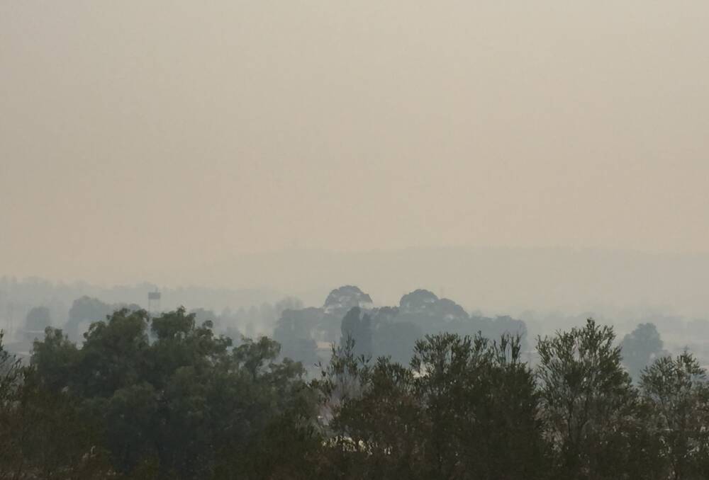Rocky Hill was barely visible in Goulburn on Friday morning. Air quality deteriorated to the worst of all the monitored sites in NSW by mid-afternoon. Photo: Louise Thrower.