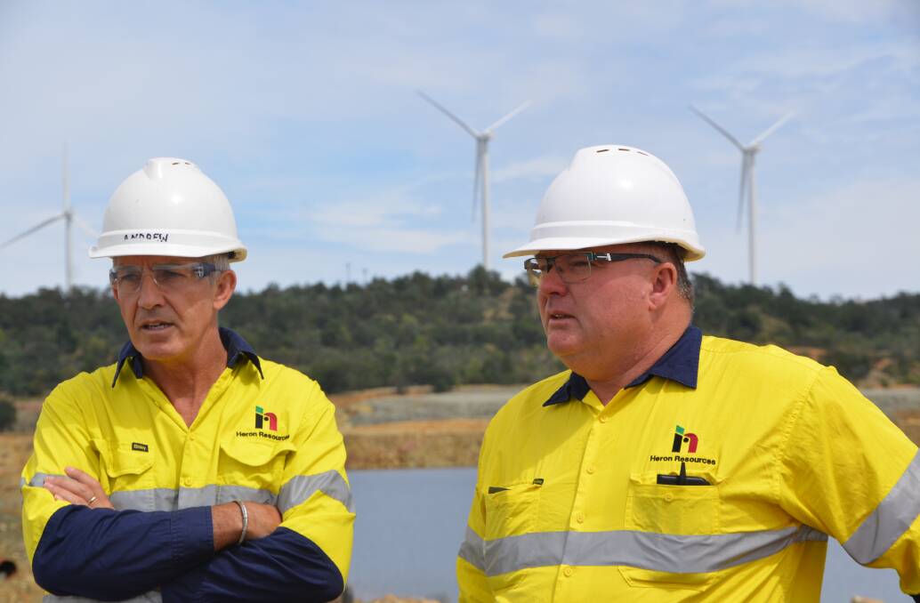 Heron Resources chief operating officer Andrew Lawry and Brian Hearne, a former Woodlawn Mine employee and now general manager at Woodlawn, discuss the project. Photo supplied.