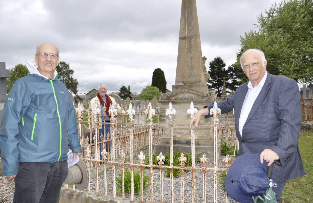 US researcher, Dr William Gilcher (left) and his assistant, Mark St Leon, at Saint Saviour's Cemetery this week with Goulburn History member, Roger Bayley. They are in front of JT Gannon's grave. Picture by Louise Thrower.