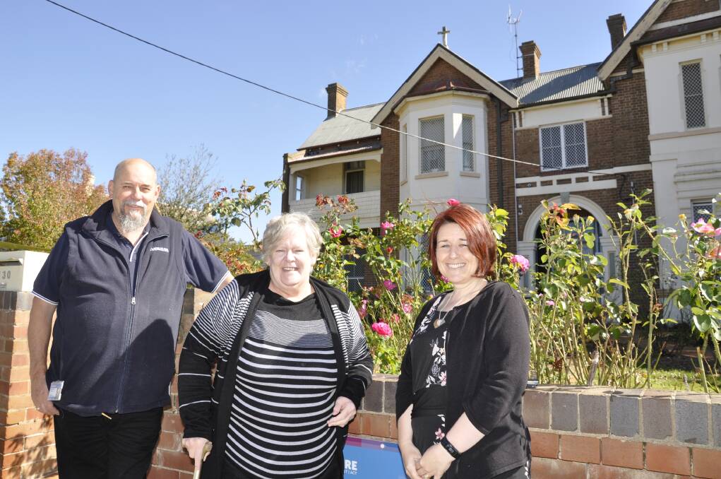 LIFESAVER: Sally Keay, pictured outside Anglicare, is grateful for the help of staff Ivan Wilson and Toni Reay in finding her an affordable home. Louise Thrower.