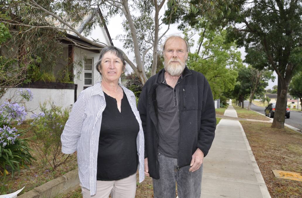 QUESTIONS: Joanne Dungey and partner Phil Fowler are concerned about design, parking, safety and environmental impacts of the proposed social housing nearby. Photo: Louise Thrower.
