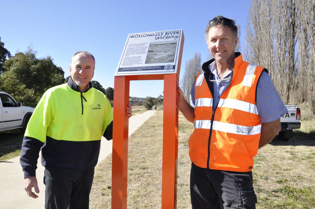 Past presidents of Goulburn Rotary Club Justin Kell and Neil Penning were busy installing one of the river signs on Friday morning. 
