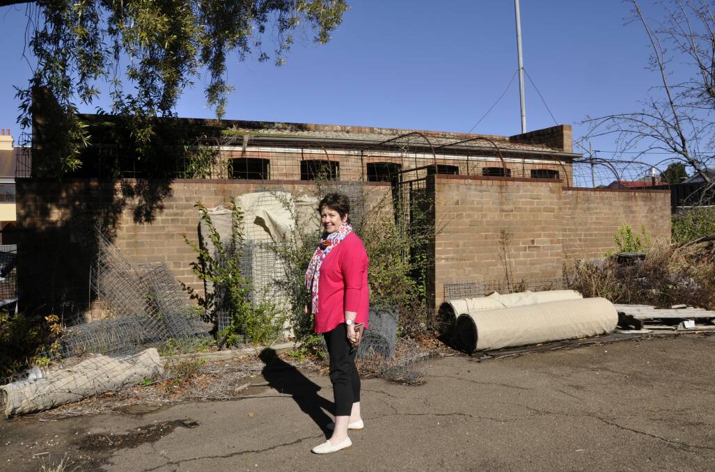 Restoration committee member Dr Ursula Stephens inspects the former Our Lady of Mercy Preparatory School toilet block that ignited the campaign for state aid for catholic schools. The structure will be adaptively re-used for a columbarium. Photo: Louise Thrower. 