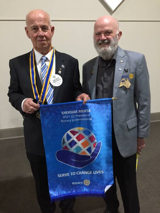 District Governor Leo Farrelly presented newly inducted Rotary Club of Goulburn president Geoff Thrower with the organisation's banner. Photo: Alex Oliver.