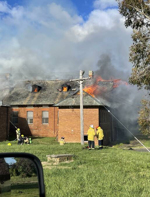 AT THE READY: Up to 50 personnel from Goulburn and district battled the blaze that broke out after 4pm Saturday at Kenmore Hospital, off Wollondilly Avenue. Photo: NSW Fire and Rescue.