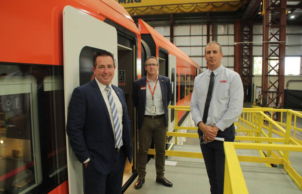 IN TRAIN: Bathurst MP Paul Toole had a sneak peek at mock carriages for the new regional train fleet in Bathurst this week with NSW TrainLink chief operating officer Dale Merrick and CAF representative Scott Evans. Photo: Bradley Jurd.