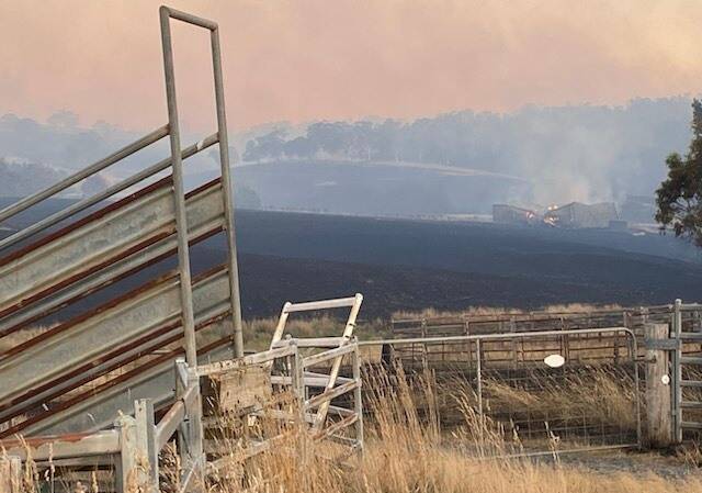 A structure was destroyed north of Taralga Road during the Curraweela fire on Thursday. Picture by Adrian Muhlsimmer.