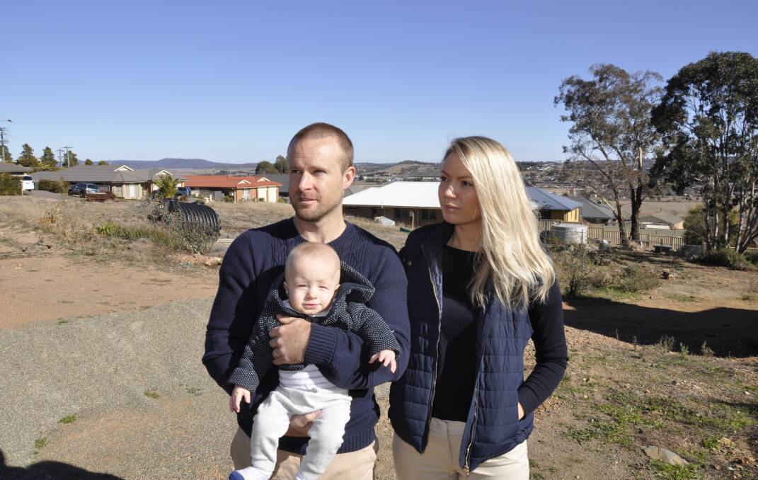 COMPLAINT: Kate and David Cartwright (with son, William), say the council cannot legally charge an archaeological fee for the Tall Timbers Estate. 