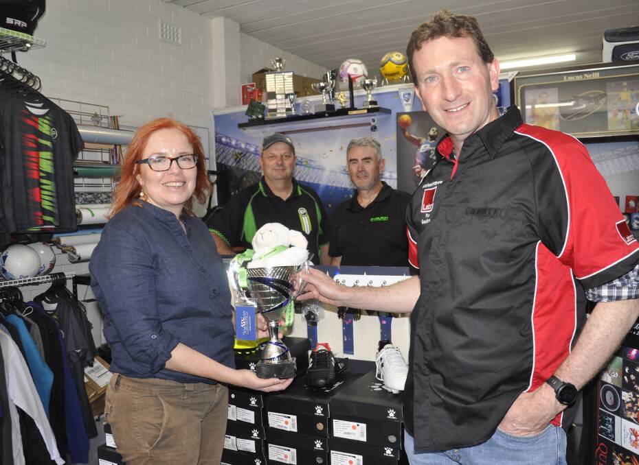 Shadow state sports minister, Julia Finn, Evolution Trophies co-owners Craig Norris and Brandon Doggett, and Labor candidate for Goulburn, Michael Pilbrow. Picture by Louise Thrower. 
