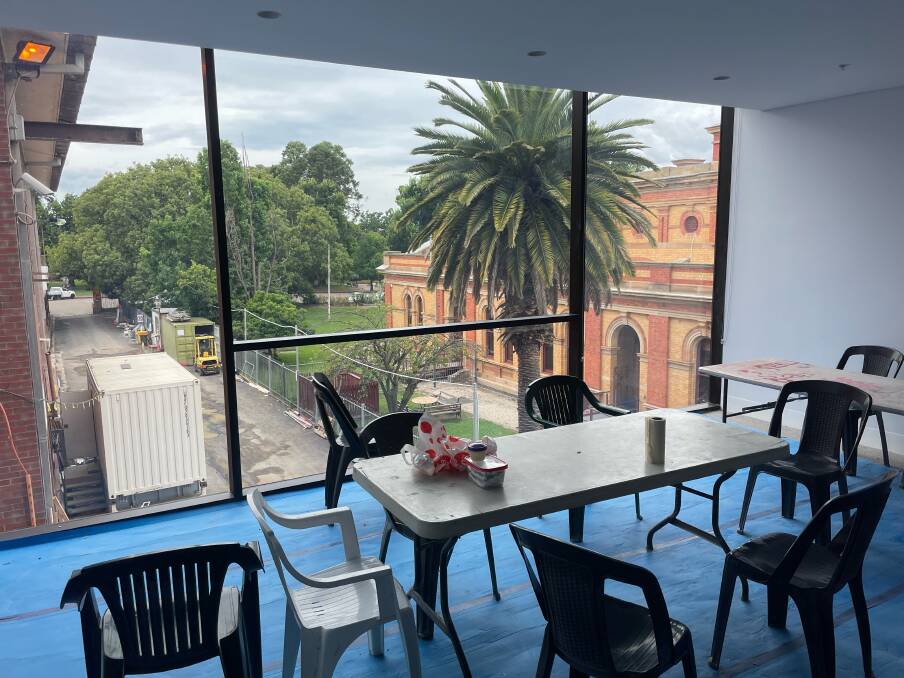 The 'green room' where performers gather for meals and after shows looks out towards the courthouse and Belmore Park. Photo supplied.