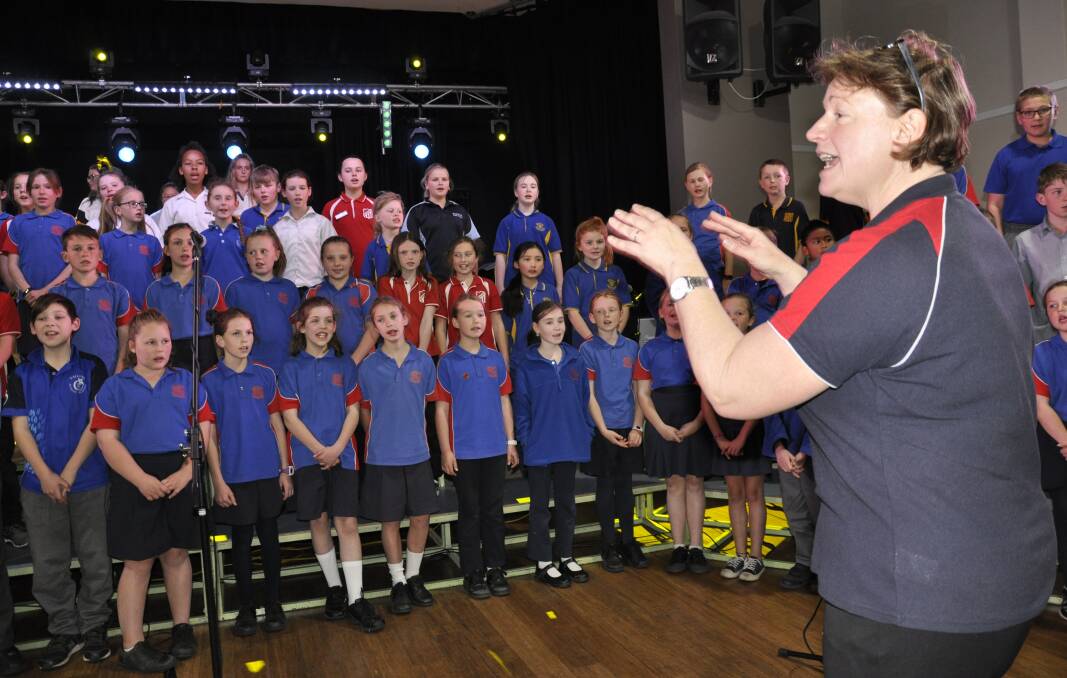 SINGING UP: Goulburn East Public School principal Charmian Cribb led students in rehearsal for the GCOPS concert on Wednesday. Photo: Louise Thrower.