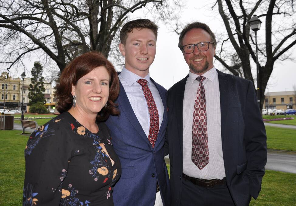 Former Trinity Catholic College student Alec Elliott with his parents Jacinta and Shane at this year's Year 12 formal. Picture by Louise Thrower.