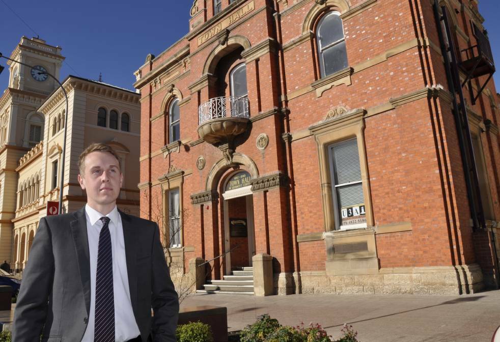 Cr Sam Rowland, pictured outside the proposed performing arts centre last year, says concerns about the venue's cost are well founded.