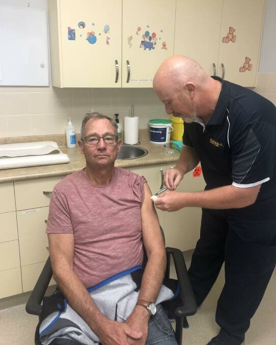 'NO PAIN': Biala man Lloyd Anderson was among the first local to receive the AstraZeneca vaccine at Marima Medical Clinic on Monday morning. Immunisation nurse Geoff Loader administered the jab. Photo supplied.