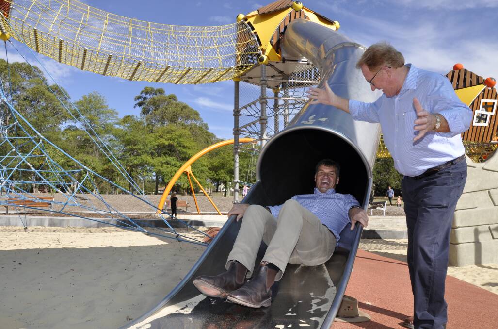 Hume MP Angus Taylor checked out the Adventure Playground equipment at Victoria Park with Mayor Bob Kirk on Saturday as he announced $180,000 for CCTV cameras for the area. Photo: Louise Thrower.